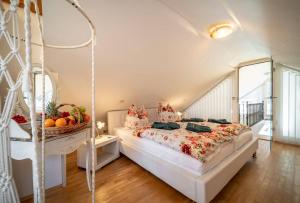 a bedroom with a bed with a basket of fruit on it at Villa Rosenburg in Thale +118 photos