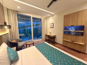 a hotel room with a bed and a large window at ARNISA Kasauli - A Boutique Hotel in Kasauli +31 photos