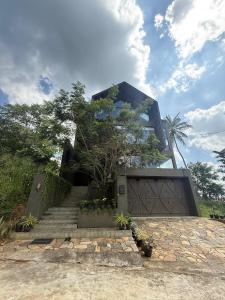 a house with a staircase leading up to it at Cinnamon Sunset Villa in Kurunegala