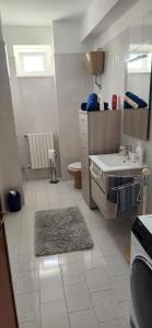 a small bathroom with a sink and a toilet at Casa Richiusa Calogero in Blufi +39 photos