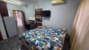 a room with a bed with a blue at Beginners Cove Lodge in Nelspruit