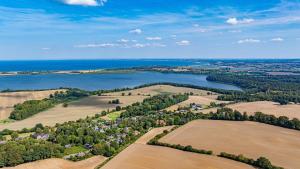 an aerial view of a river and fields at Weiße Reetdachkate Wohnung 2 in Stöfs