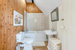 a bathroom with a white toilet and a sink at 4 Bed in Bridport oc-58847 in Powerstock +33 photos