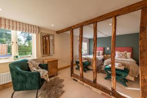 a bedroom with a bed and a large mirror at 3 Bed in Hereford oc-83659 in Madley