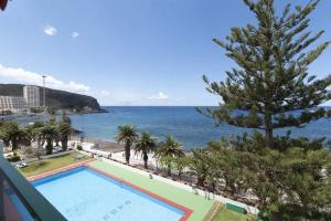 a view of the ocean from the balcony of a resort at Ocean View 3 in Los Cristianos