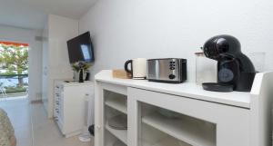 a kitchen with a toaster on a white counter at Ocean View 3 in Los Cristianos