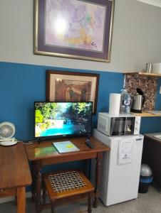 a desk with a computer on top of it at The Hidden Corner in Sedgefield