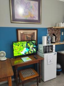 a computer monitor sitting on a desk in a kitchen at The Hidden Corner in Sedgefield