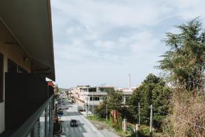 a view of a city street from a balcony at Aura Residence in San Biagio