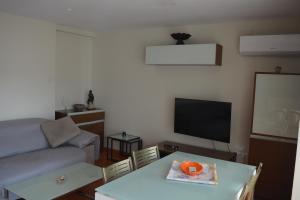 a living room with a couch and a table at Casa Paola in Buñol +28 photos