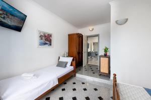 a bedroom with a bed in a room at Apartment Tomic Makarska in Makarska +32 photos