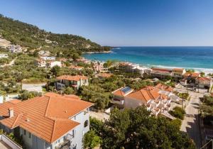 an aerial view of a town and the ocean at Doma by Kristina in Chrysi Ammoudia +18 photos