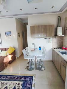 a kitchen with a table and chairs in a room at Jones house in Nea Fokea
