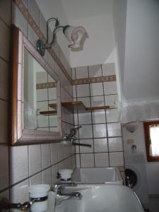 a bathroom with a sink and a mirror at Nido di Rondine in Montespertoli