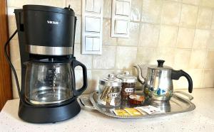 a coffee maker sitting on top of a counter at Sergio's homes in Mélanes