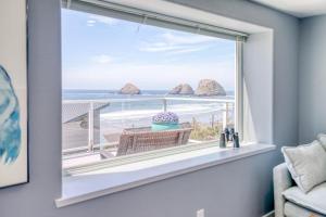 a window in a room with a view of the ocean at Serendipity -A Happy Surprise Unit A in Oceanside