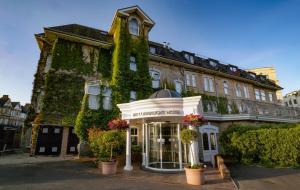 a building with ivy on the side of it at Best Western Plus The Connaught Hotel and Spa in Bournemouth