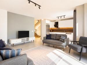 a living room with two couches and a television at Villa Exclusive Paradise 2 in Dalyan