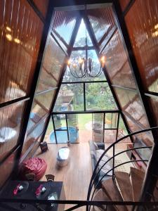 an overhead view of a room with a large window at Chalé da lagoa in Lagoa Santa