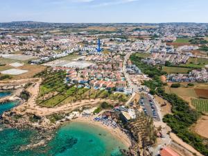 an aerial view of a resort on the beach at PANKI Beach Villa Protaras in Protaras