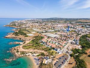an aerial view of a town on the beach at PANKI Beach Villa Protaras in Protaras