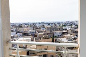 a view of a city from a balcony at VIP Home in El Aouina Station
