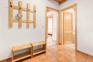 a room with skis on the wall and a bench at Mayerbauer in Piding +39 photos