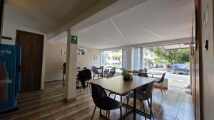 a dining room with a table and chairs at Naiot Hotel Boutique in Medellín