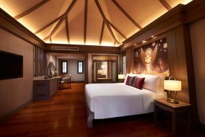 a bedroom with a large white bed and a desk at Amari Vogue Krabi in Tab Kaek Beach +102 photos