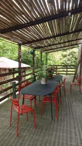 a group of tables and chairs on a patio at Agriturismo Coradosso "La casetta" in Selvapiana