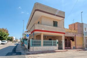 a building on the side of a street at Casa Lucia a Torre Lapillo in Torre Lapillo