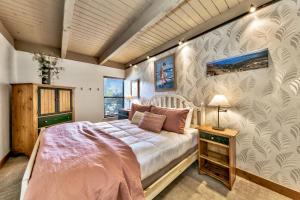a bedroom with a bed and a wall at Lakeland Village #476 in South Lake Tahoe