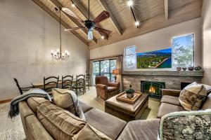 a living room with a couch and a fireplace at Lakeland Village #476 in South Lake Tahoe +11 photos