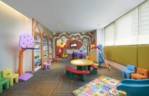 a childrens play room with a table and chairs at Shama Lakeview Asoke Bangkok in Bangkok +187 photos