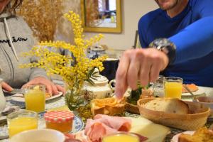 a group of people sitting at a table with food at Cal Blasi in Montblanc