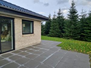 a patio in front of a house at New apartment, only 4 km from the highway in Horsens