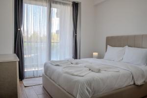 a bedroom with a large bed with a large window at Lale Saray Sapanca in Sapanca +96 photos