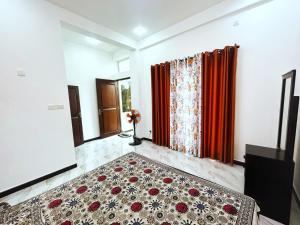 a room with a bed and a rug on the floor at cassiopeia escape in Kottawa +5 photos