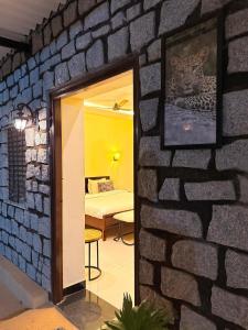 a brick wall with a picture of a leopard at Atithi Leopard Camp - Jawai in Sānderao