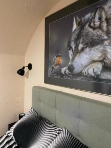 a picture of a wolf and a bird at Rabbit Hole Hotel in Laiksaare