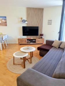 a living room with a couch and a table at Apartamento Lliris Atico in L'Estartit