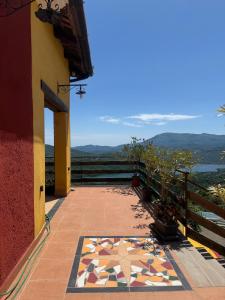a balcony with a mosaic floor on a building at Casa Vacanze Panoramika Santa Cruz - FAMILY ROOM in Cicerale