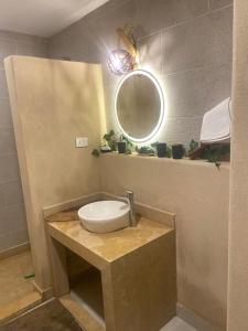 a bathroom with a sink and a mirror at Arwaa Boutique in Dahab +6 photos