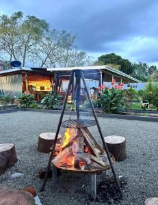 a fire pit in front of a house at Almasi lounge in Arusha