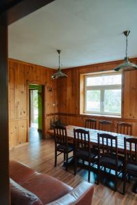 a dining room with a table and chairs at agroOBERIBA in Płatkownica