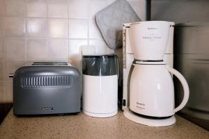 two appliances sitting on a counter next to a toaster at Aphrodite Residence - Seafront apartment, Melissi in Melíssion
