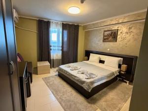 a bedroom with a large bed in a room at Hotel Yal Restaurant in Tetovo +29 photos
