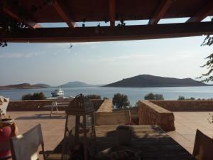 a view from a patio with a view of the water at Villa Aristoteles in Halki