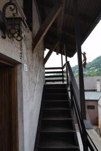 a stairway leading up to a building with a stair case at Casa dello Scoiattolo in Bieno +8 photos