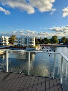 a view of the water from the deck of a building at SolMarina Apartment for Rent in Wiślinka